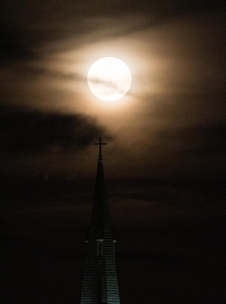 Moon Rises Behind the Spire of St. Dominic Church